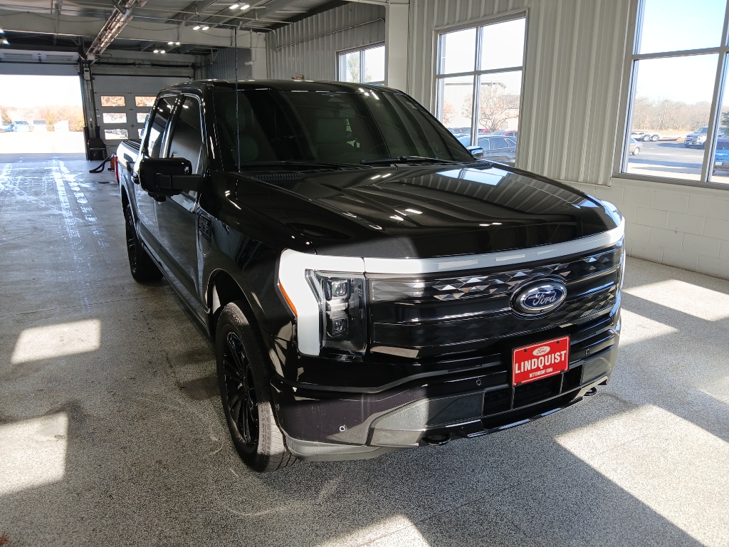 Certified 2023 Ford F-150 Lightning Platinum with VIN 1FT6W1EV9PWG34742 for sale in Bettendorf, IA