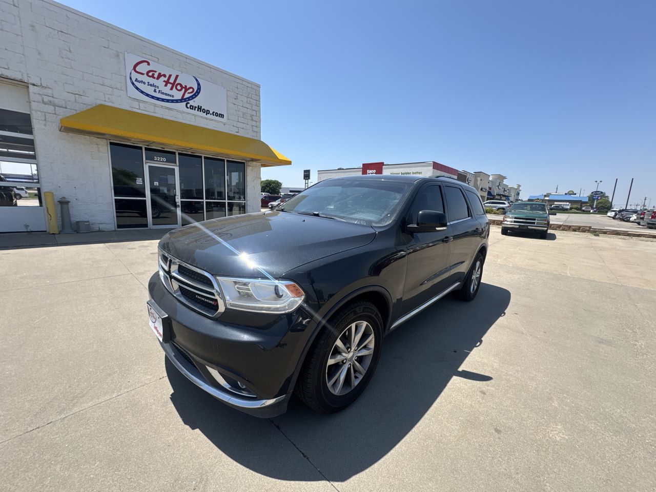 Used 2014 Black Dodge Limited Sport Utilit image 1