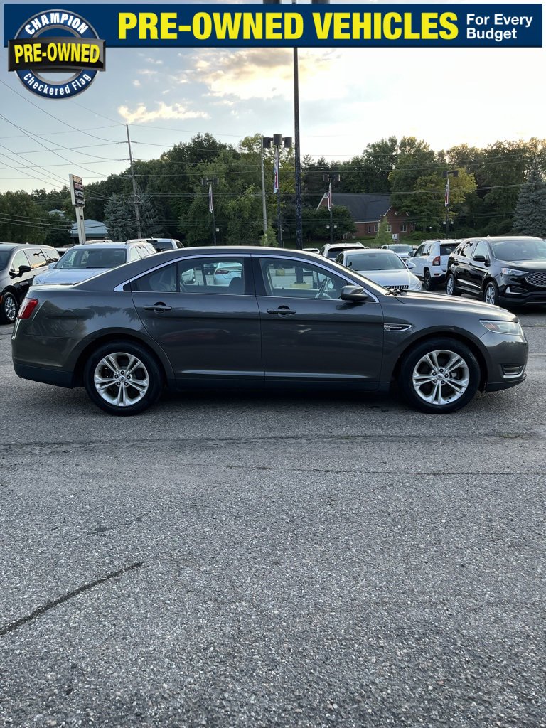 Used 2015 Ford Taurus SEL with VIN 1FAHP2E84FG206565 for sale in Brighton, MI