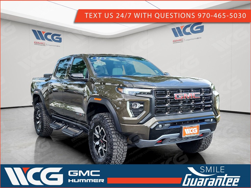 Used 2024 Deep Bronze Metallic GMC AT4X image 1