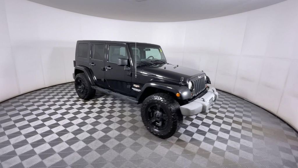 Used 2010 Jeep Wrangler Unlimited Sahara with VIN 1J4HA5H18AL134159 for sale in Atlanta, GA