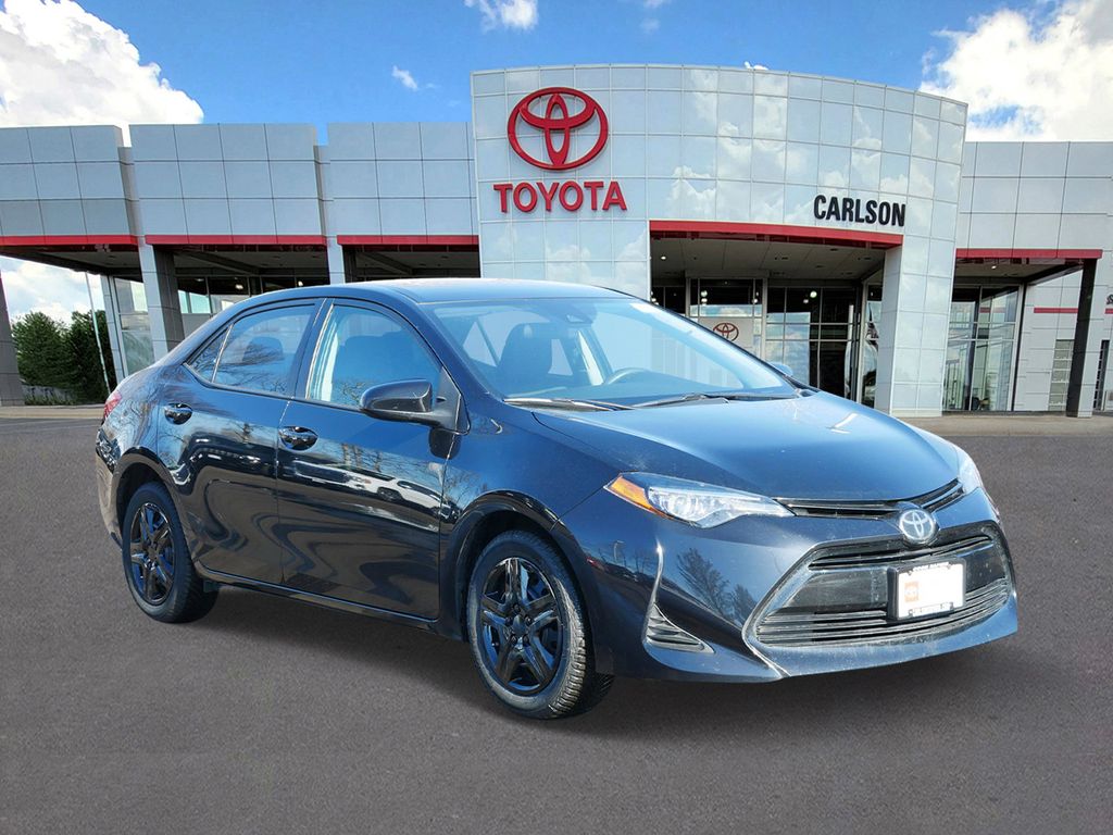 Certified 2018 Toyota Corolla LE with VIN 2T1BURHE8JC974012 for sale in Minneapolis, Minnesota