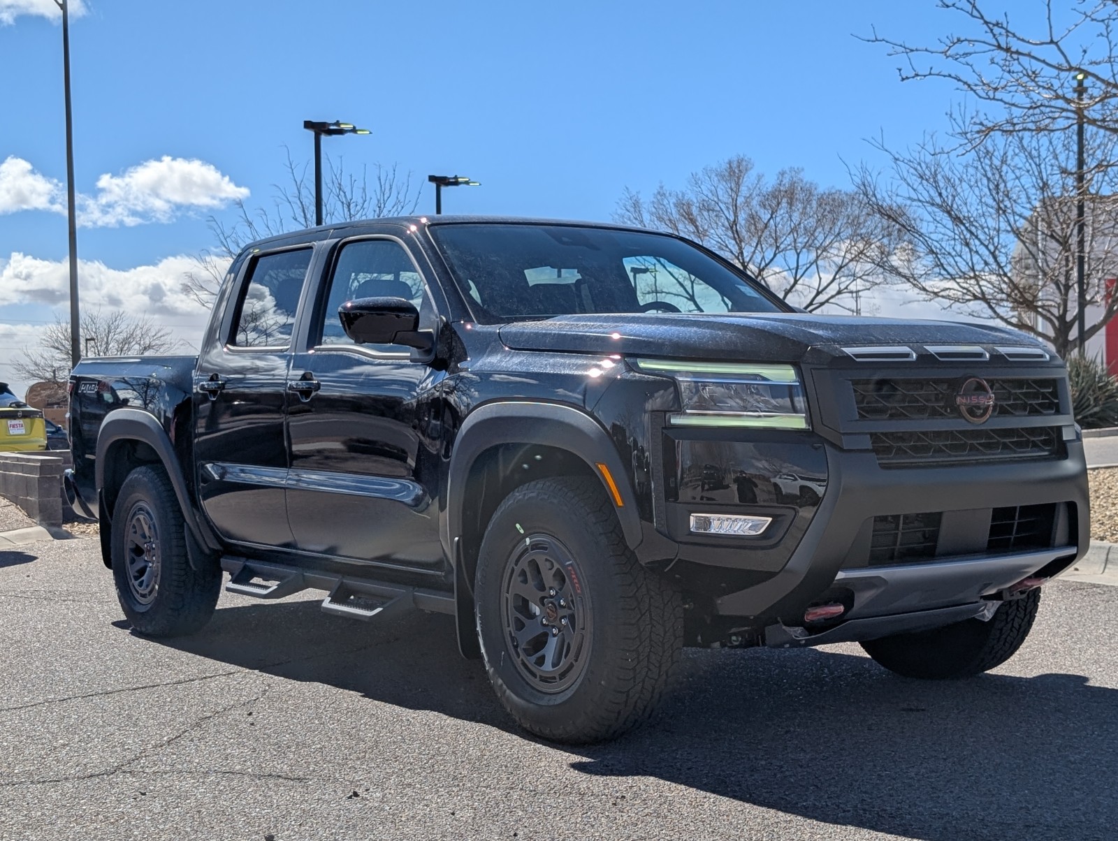 New 2025 Super Black Nissan Crew Cab PRO-4X® image 1