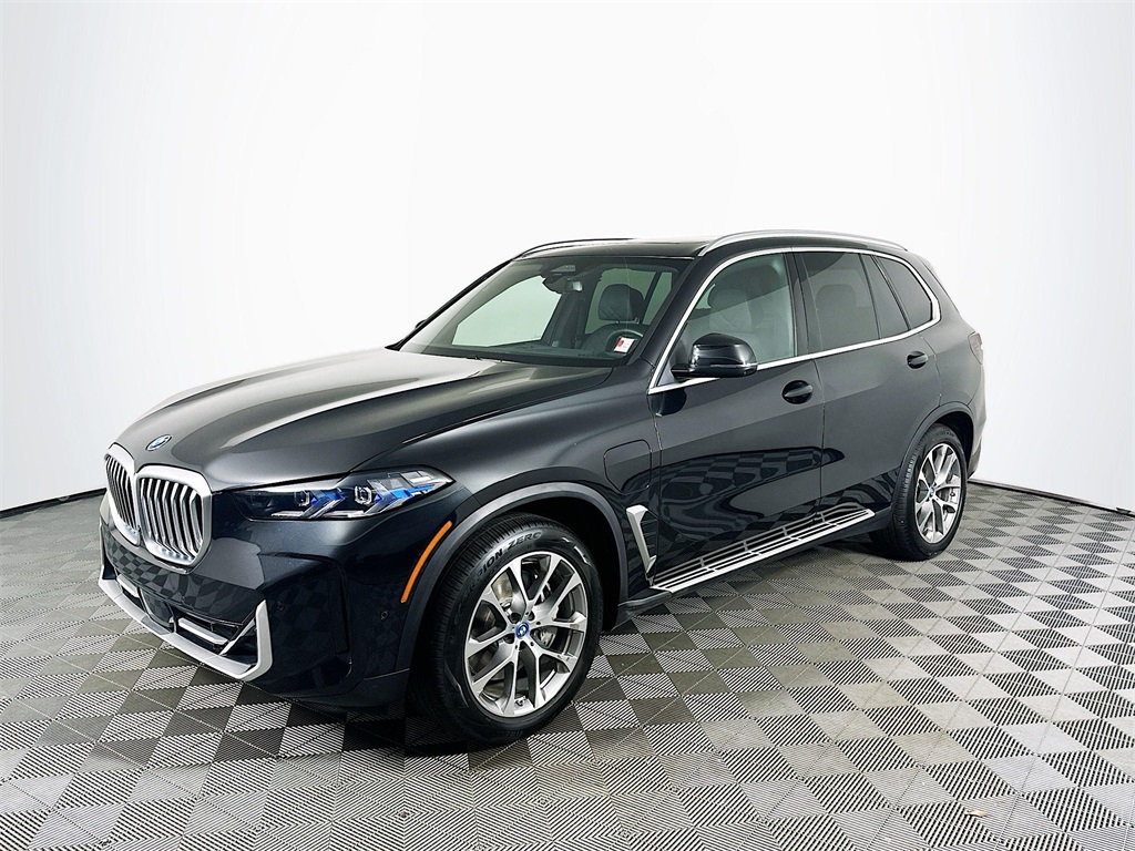 Used 2025 Black Sapphire Metallic BMW xDrive50e image 1