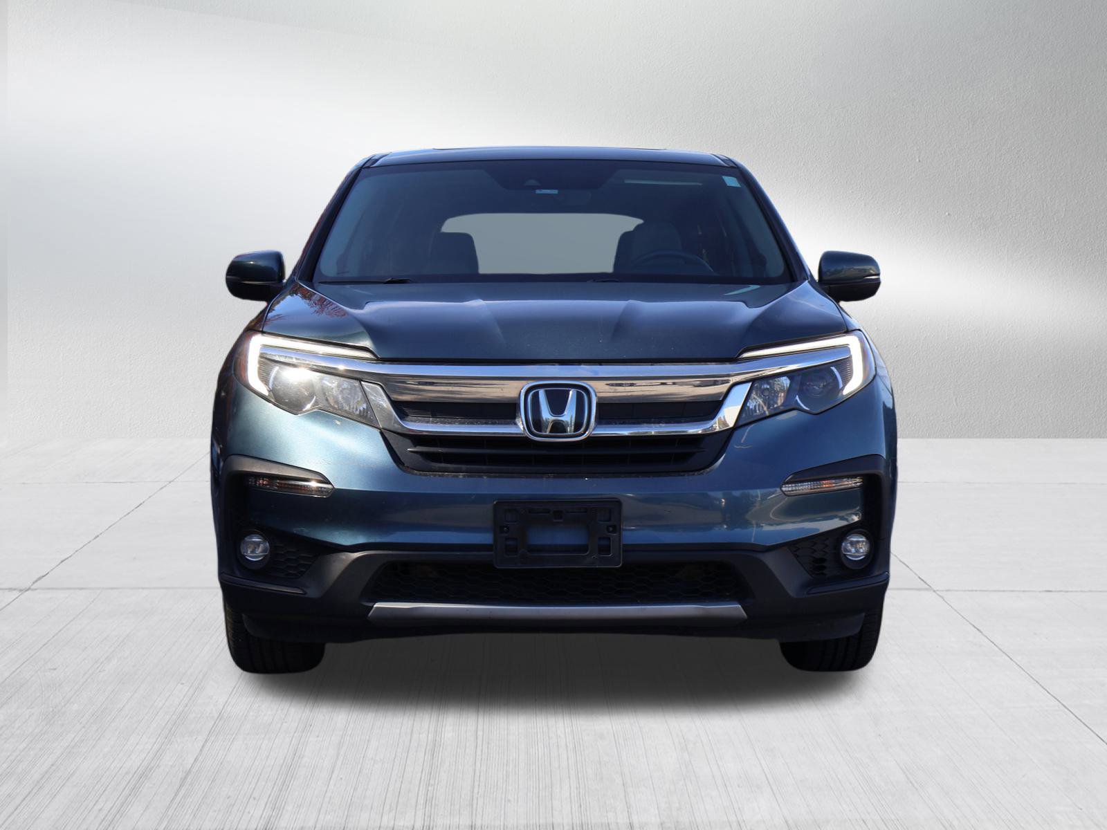 Used 2021 Honda Pilot EX-L with VIN 5FNYF6H56MB031409 for sale in Kansas City