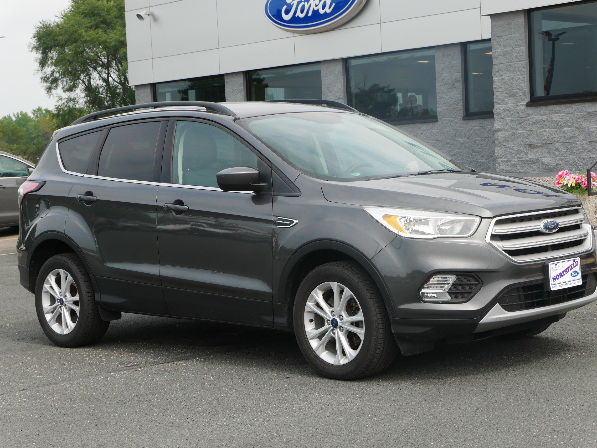 Used 2018 Ford Escape SE with VIN 1FMCU9GD2JUA97786 for sale in Northfield, Minnesota