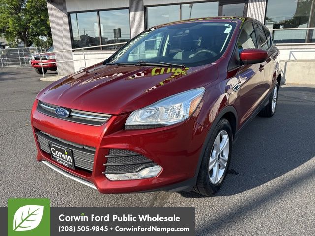 Used 2016 Orange Ford SE image 1