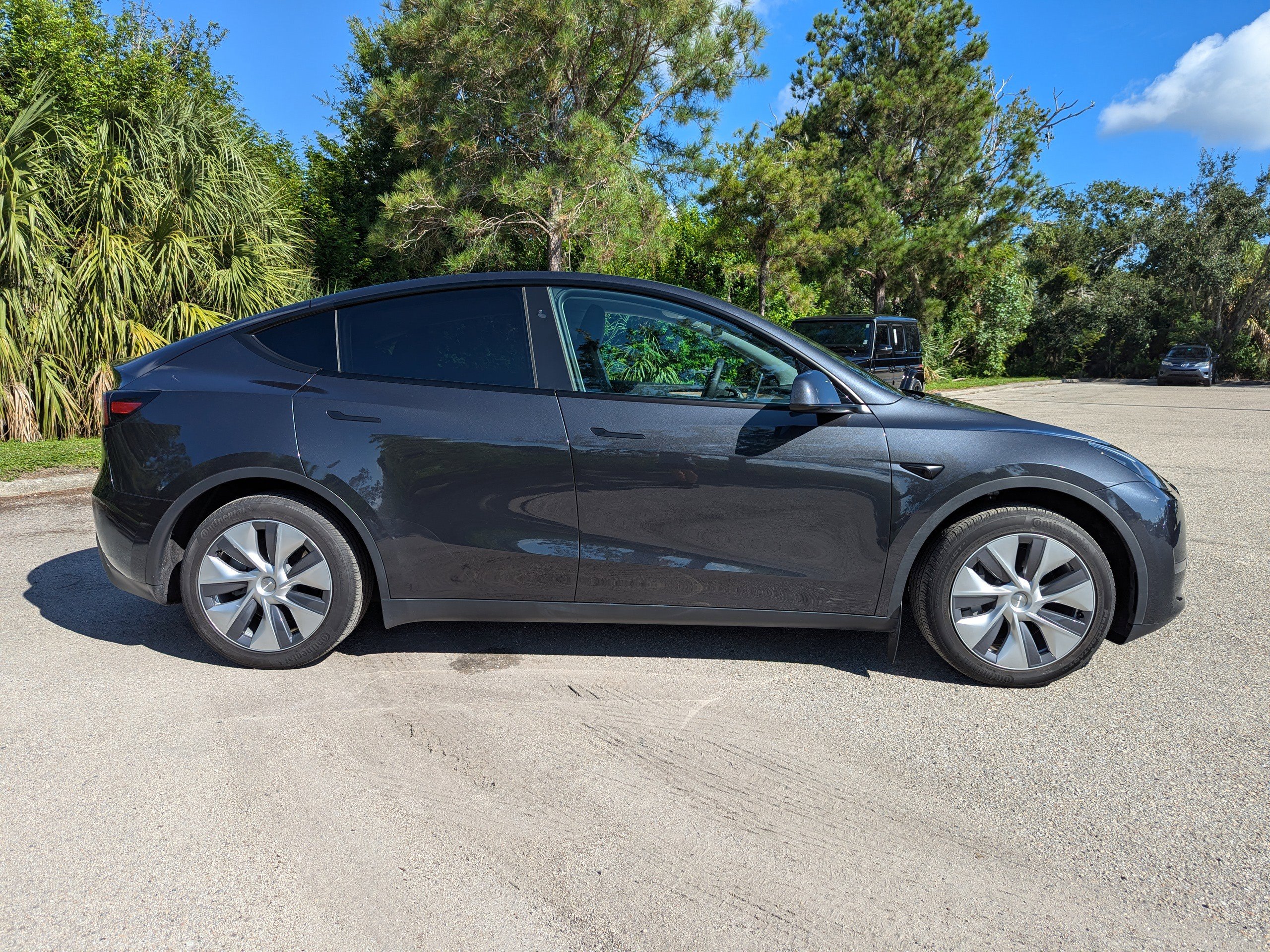 Used 2024 Tesla Model Y Long Range with VIN 7SAYGDED1RF048187 for sale in Sarasota, FL