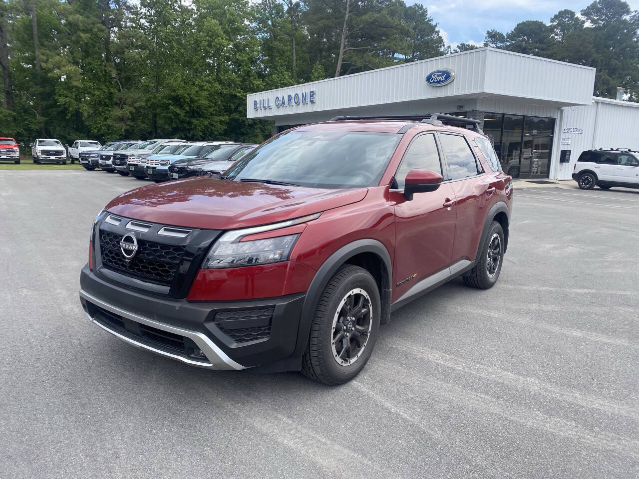 Used 2025 Scarlet Ember Nissan Rock Creek AWD 4dr SUV image 1