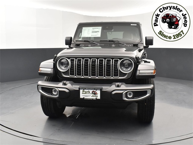 Used 2024 Jeep Wrangler 4-Door Sahara with VIN 1C4PJXEG1RW299244 for sale in Burnsville, Minnesota