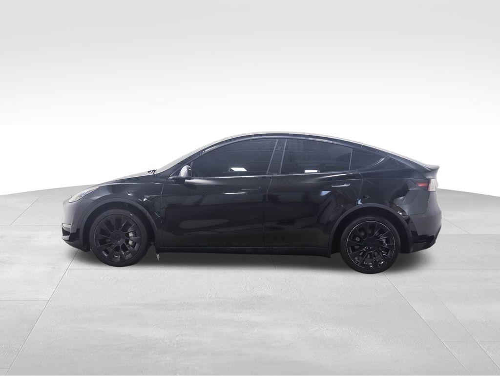 Used 2024 Tesla Model Y Long Range with VIN 7SAYGDEE4RA233243 for sale in Minneapolis, MN