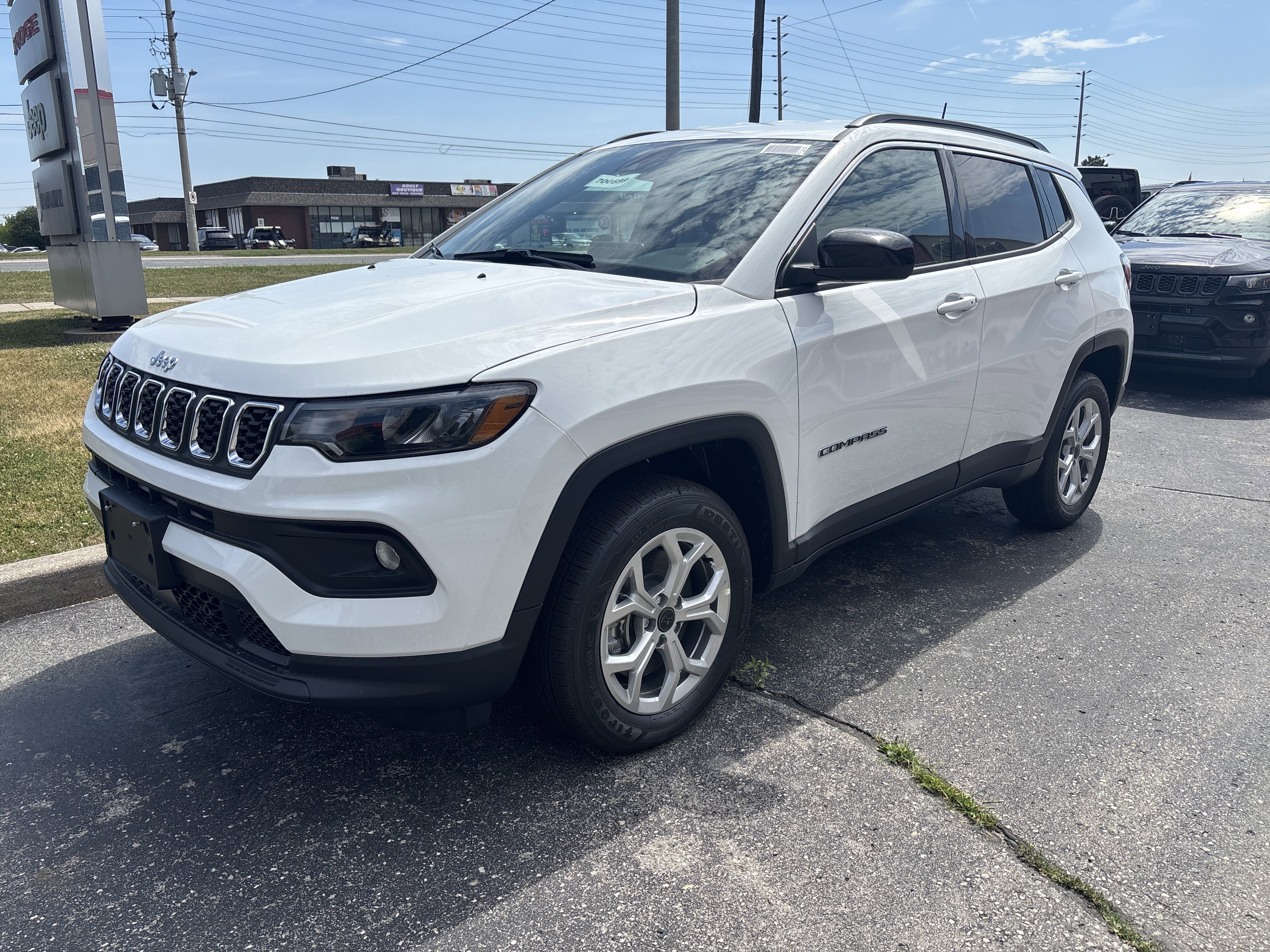 New 2025 Bright White Jeep North image 1