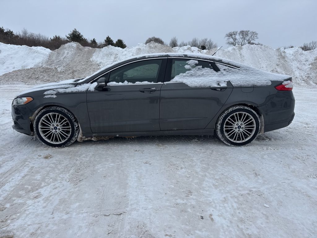 Used 2015 Ford Fusion SE with VIN 3FA6P0T9XFR249890 for sale in Traverse City, MI