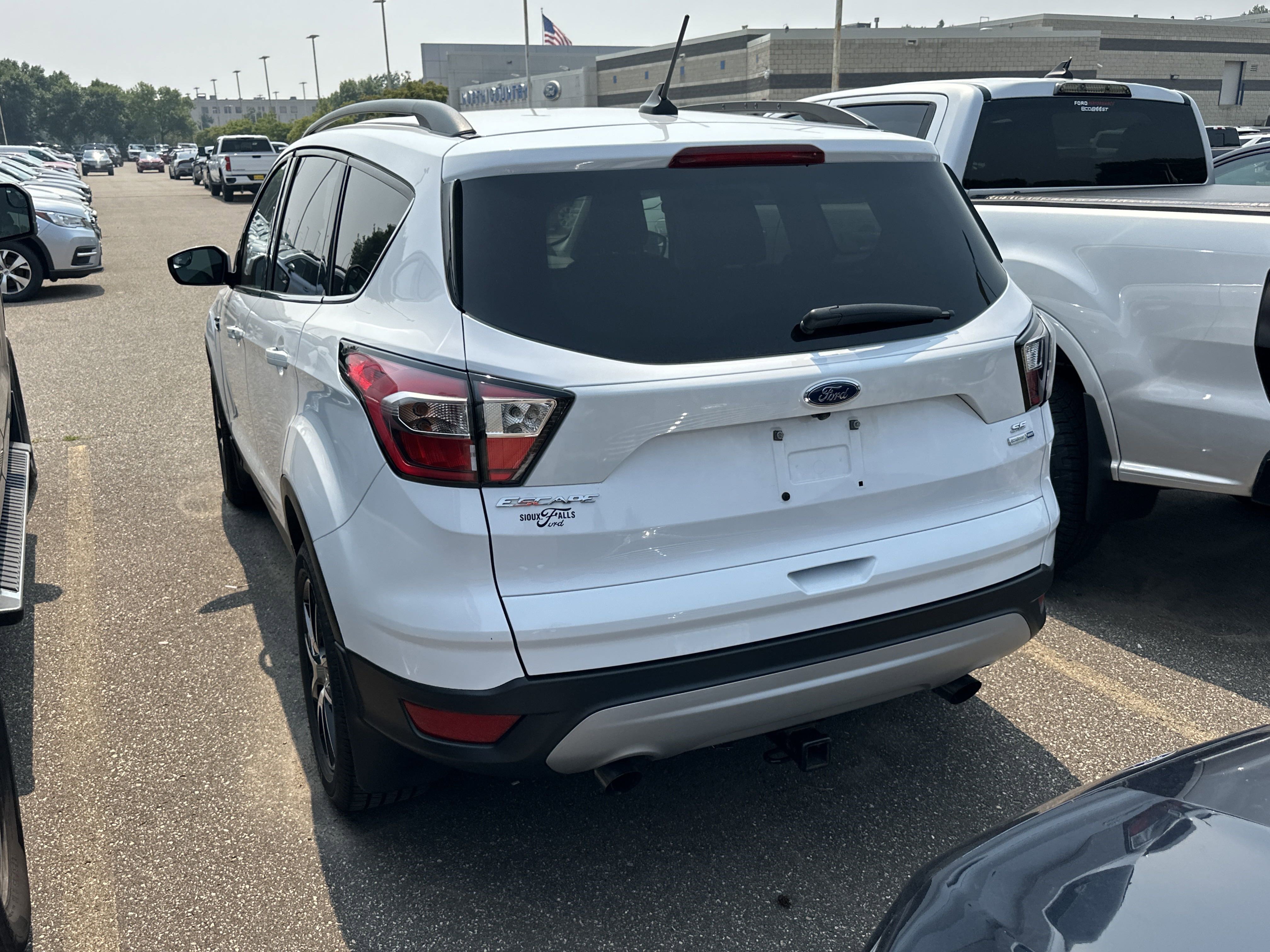 Used 2018 Ford Escape SE with VIN 1FMCU9GD9JUA42333 for sale in Coon Rapids, Minnesota