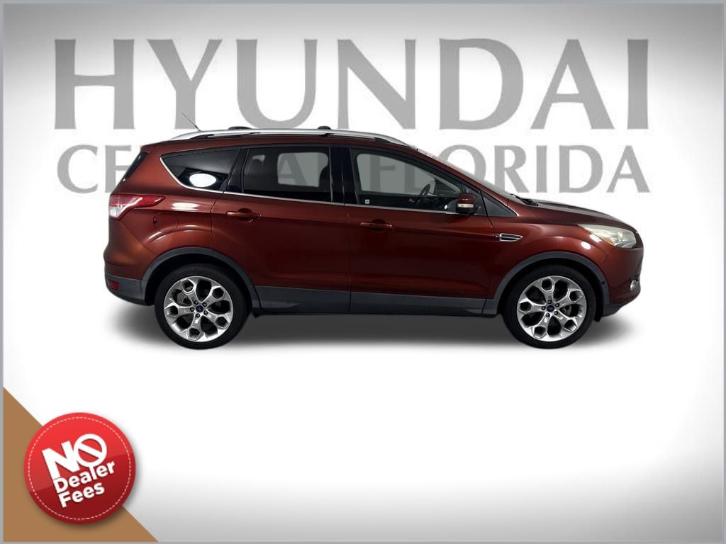 Used 2016 Ford Escape Titanium with VIN 1FMCU0J95GUB04013 for sale in Clermont, FL