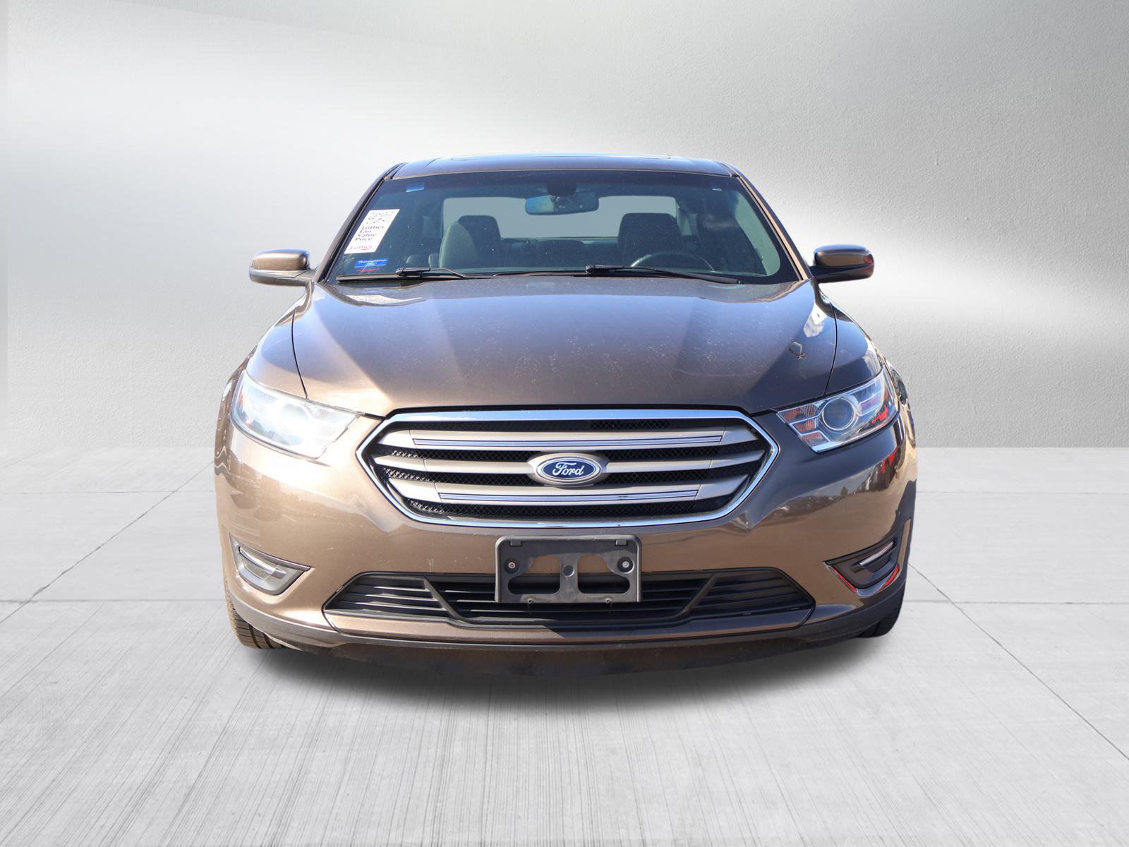 Used 2015 Ford Taurus SEL with VIN 1FAHP2E83FG182985 for sale in Kansas City