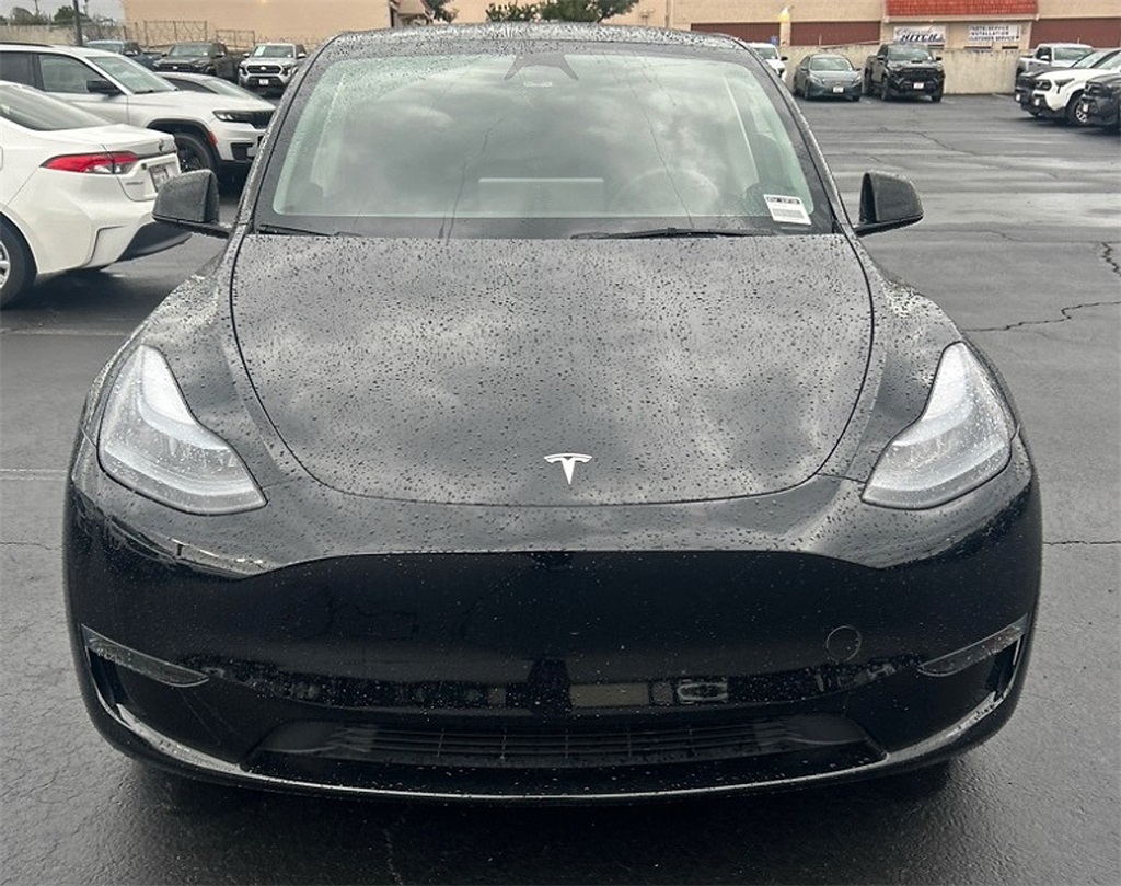 Used 2025 Tesla Model Y Long Range with VIN 7SAYGDED6SF311098 for sale in Kansas City