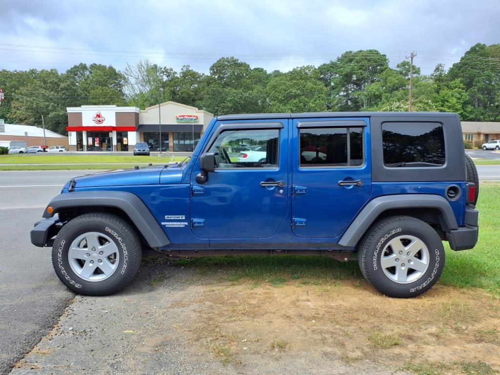 Used 2010 Jeep Wrangler Unlimited Sport with VIN 1J4BB3H11AL120238 for sale in Hartselle, AL