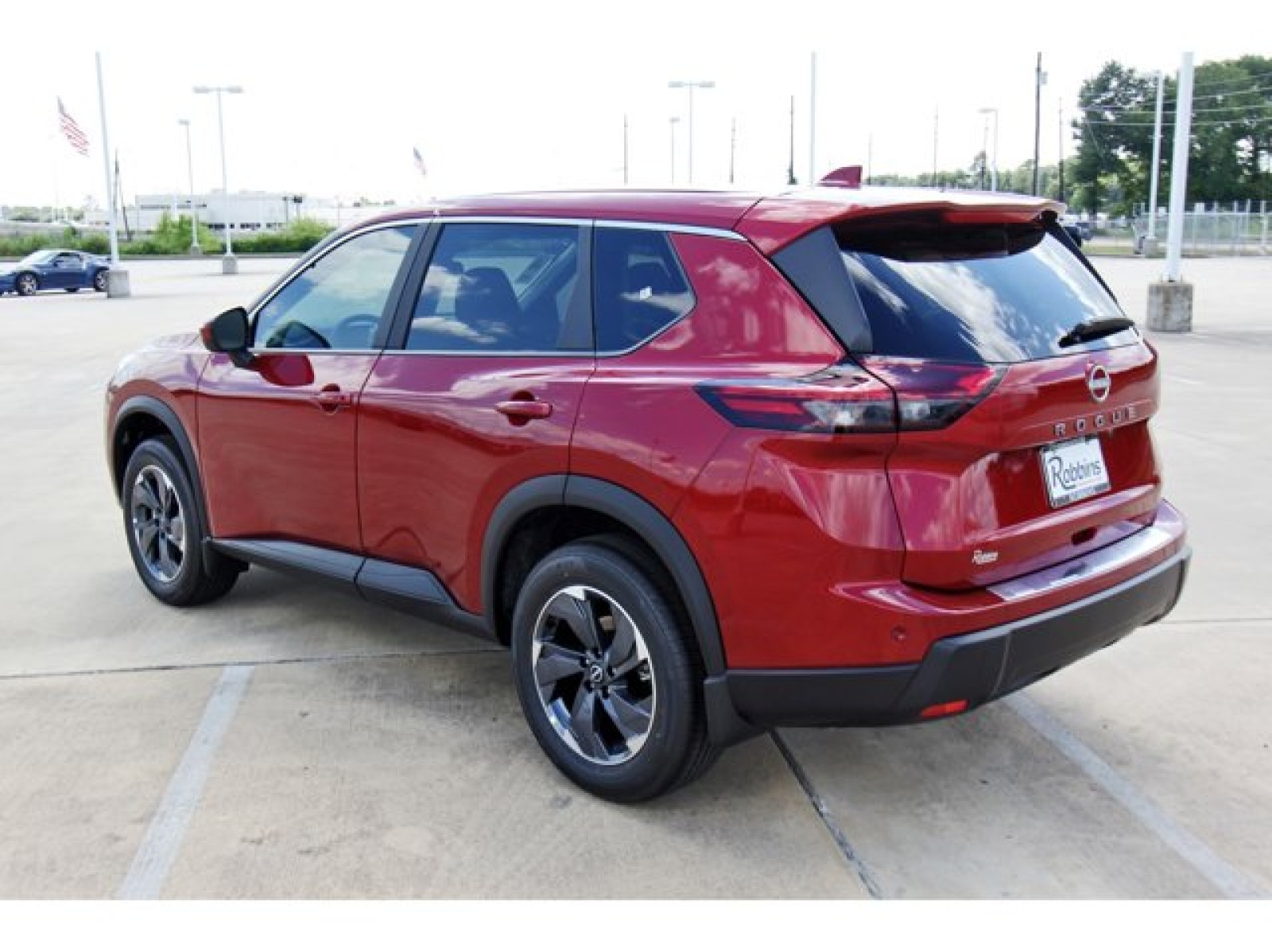 2026 Nissan Rogue SV Red at Robbins Nissan