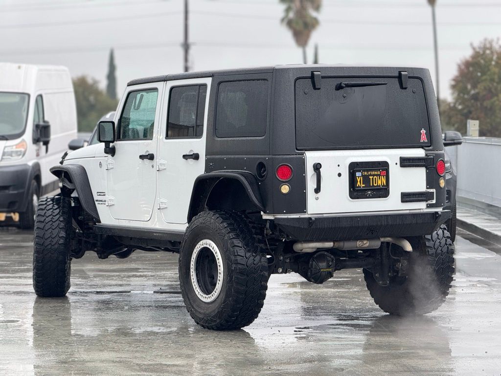 Used 2014 Jeep Wrangler Unlimited Sport with VIN 1C4BJWDG7EL159636 for sale in Claremont, CA