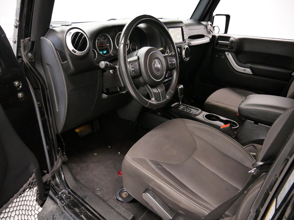 Used 2015 Jeep Wrangler Unlimited Sahara with VIN 1C4BJWEG2FL697967 for sale in Coon Rapids, Minnesota