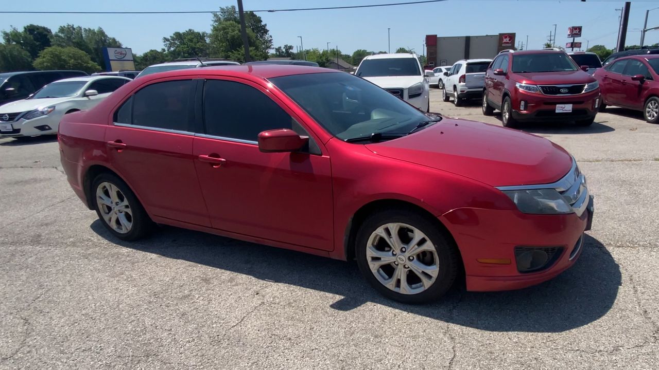 Used 2012 Maroon Ford SE image 1