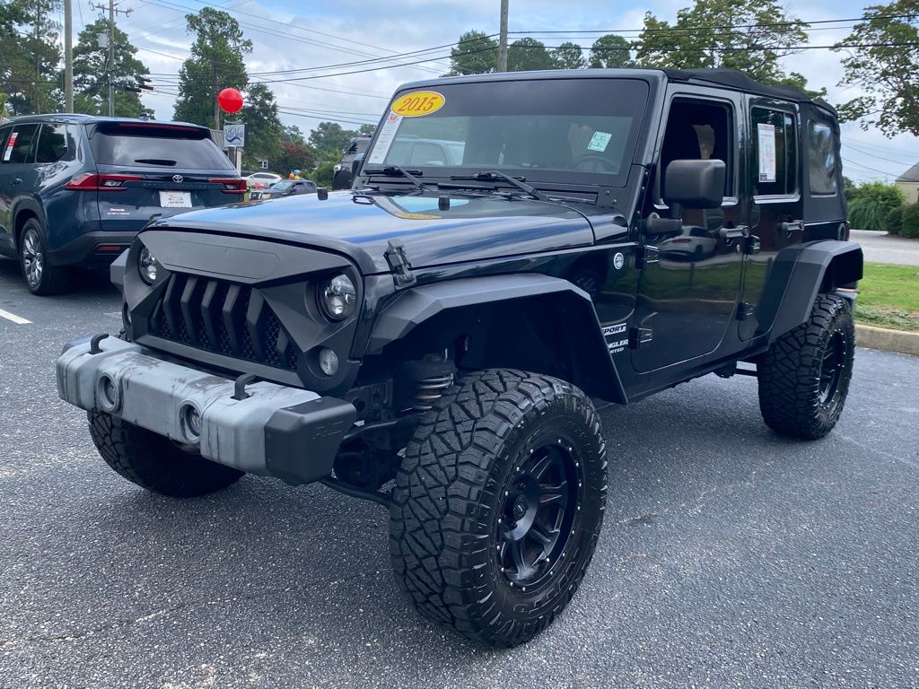 Used 2015 Jeep Wrangler Unlimited Sport with VIN 1C4BJWDG1FL593388 for sale in Florence, SC