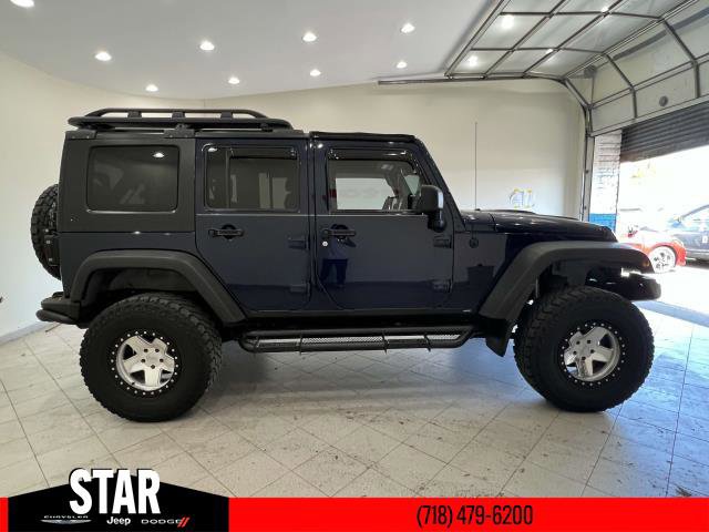Used 2013 Jeep Wrangler Unlimited Sport with VIN 1C4BJWDG8DL520239 for sale in Queens, NY