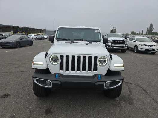 Used 2022 Jeep Wrangler Unlimited Sahara 4XE with VIN 1C4JJXP69NW106682 for sale in Kansas City