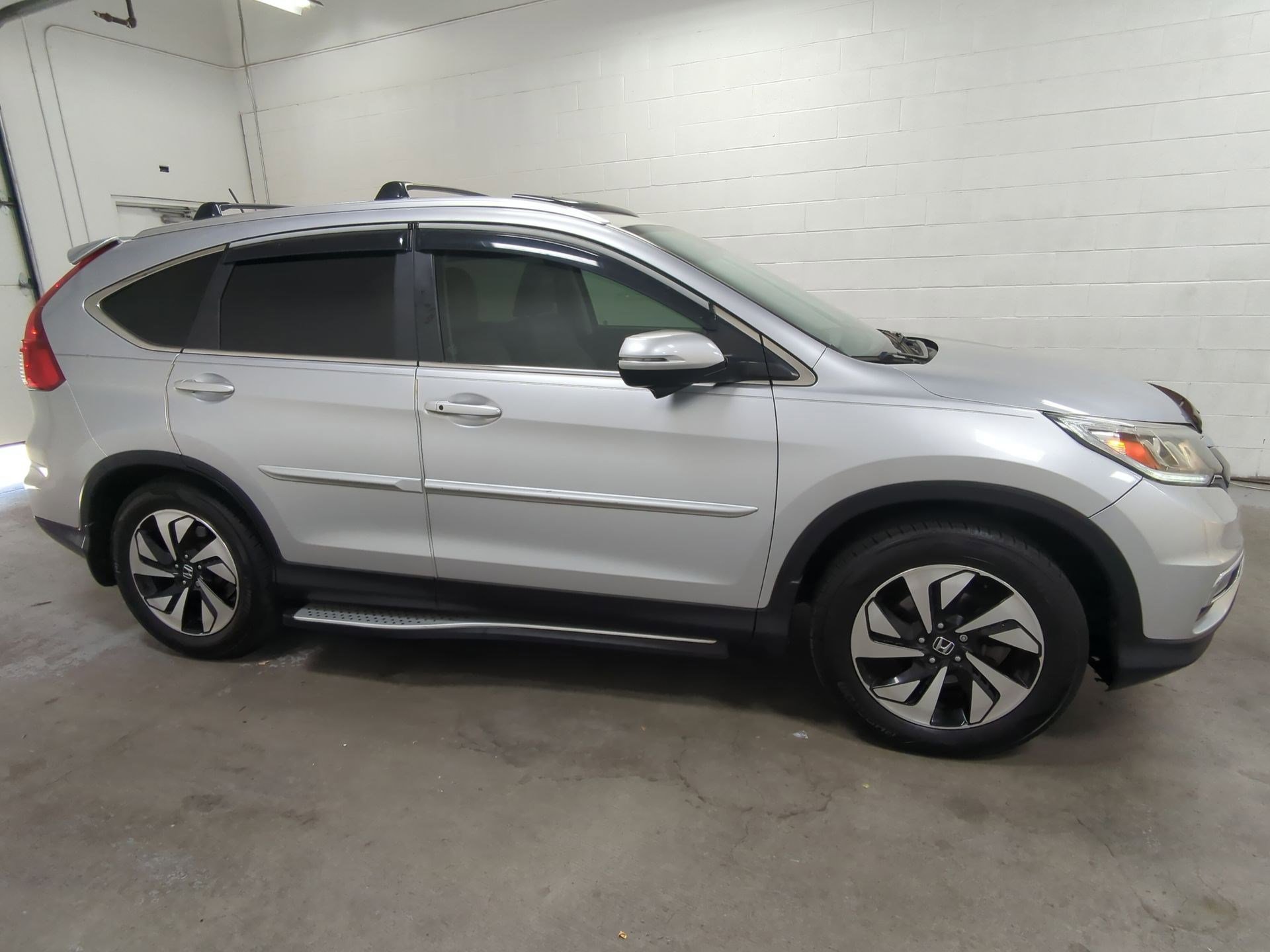 Used 2015 Honda CR-V Touring with VIN 5J6RM3H9XFL007314 for sale in West Valley City, UT