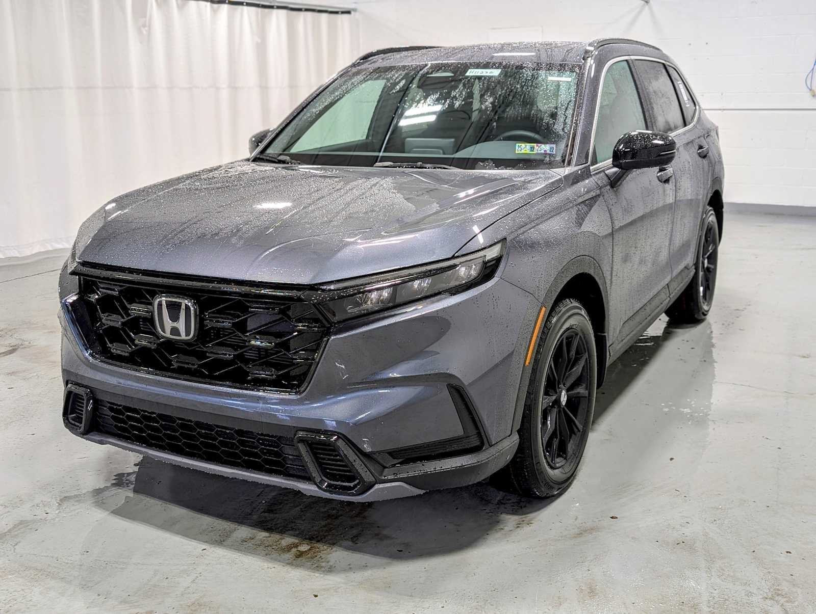 New 2025 Honda CR-V HYBRID AWD SPORT in Meteorite Gray Metallic 