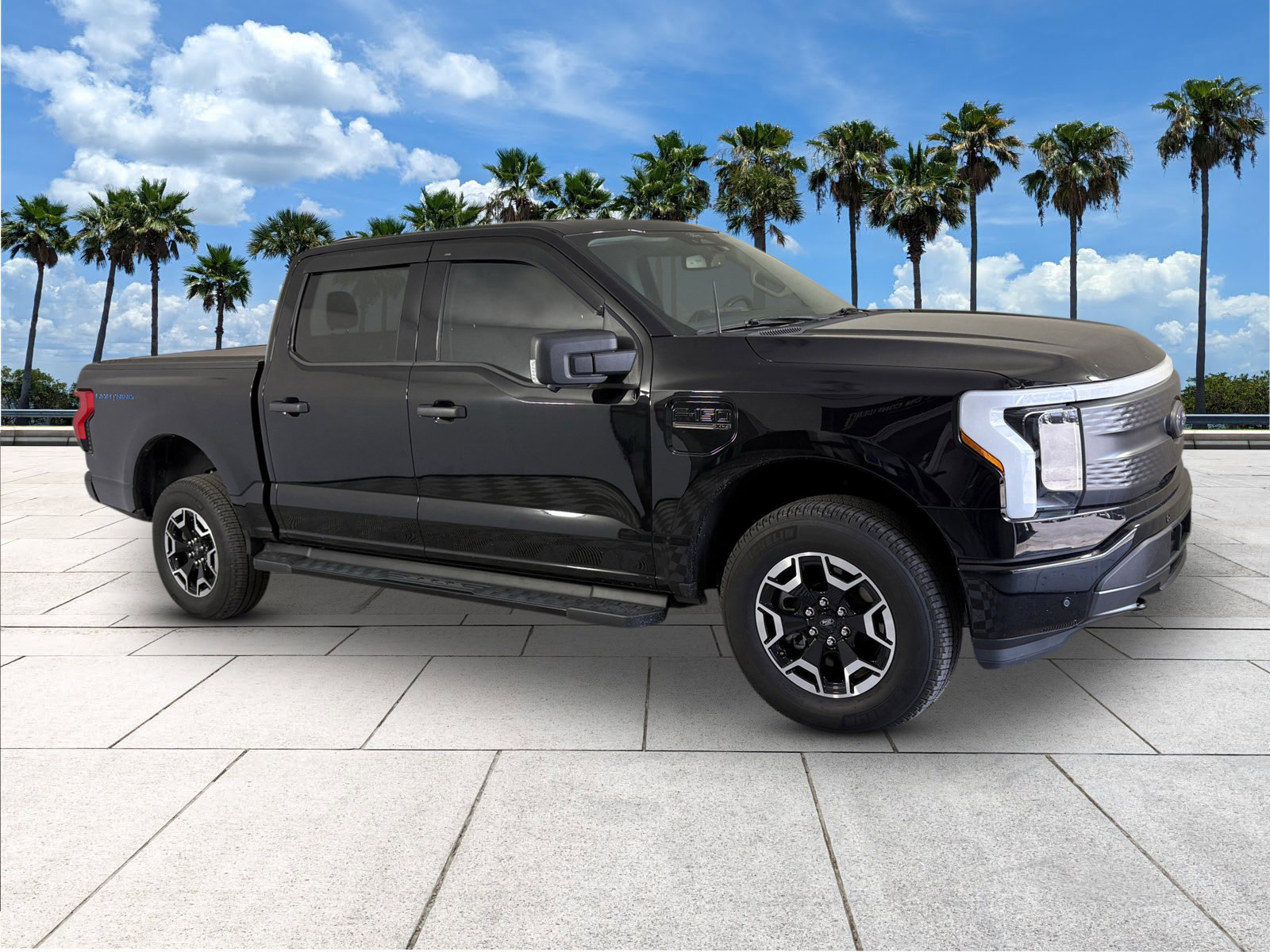 Used 2022 Ford F-150 Lightning XLT with VIN 1FTVW1ELXNWG09761 for sale in Port Richey, FL