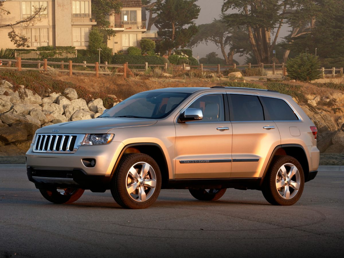 Used 2011 White Jeep Laredo image 1