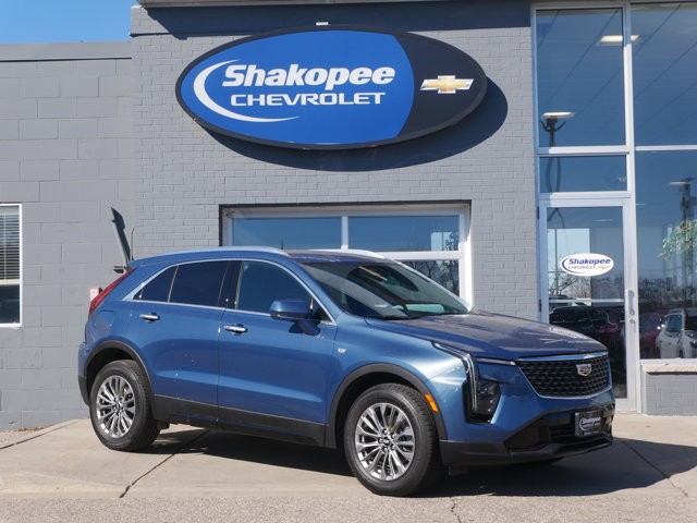 Used 2024 Deep Sea Metallic Cadillac Premium Luxury image 1
