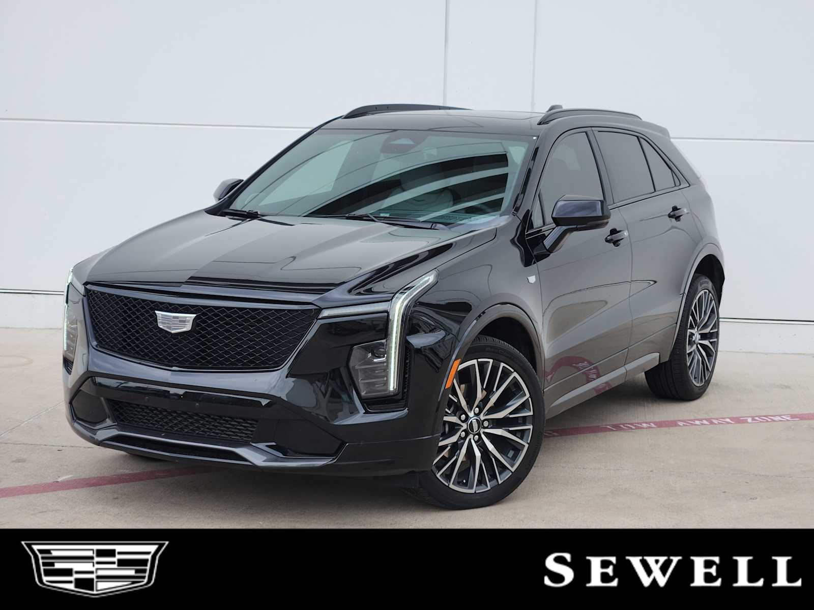 Certified Used 2024 Stellar Black Metallic Cadillac Sport image 1