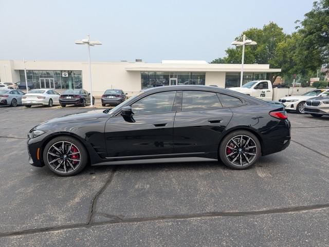 Certified Used 2024 Black Sapphire Metallic BMW M440i xDrive image 1