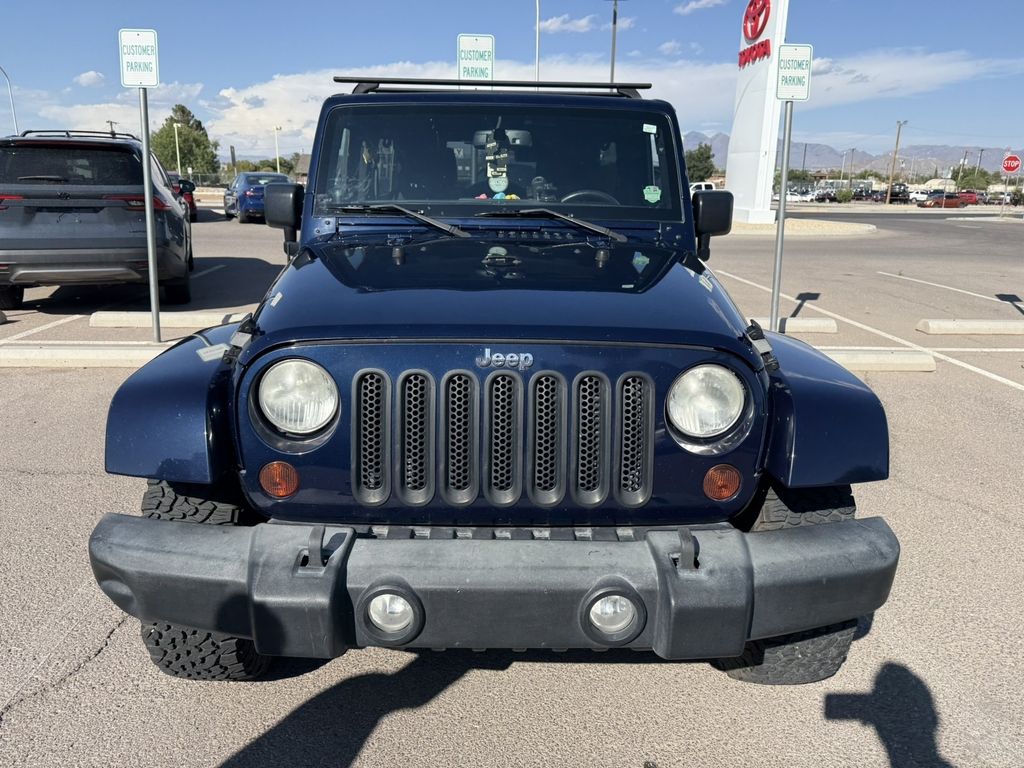 Used 2013 Blue Jeep Unlimited Sahara image 4
