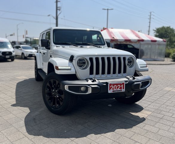 Used 2021 Bright White Jeep Unlimited Sahara image 1