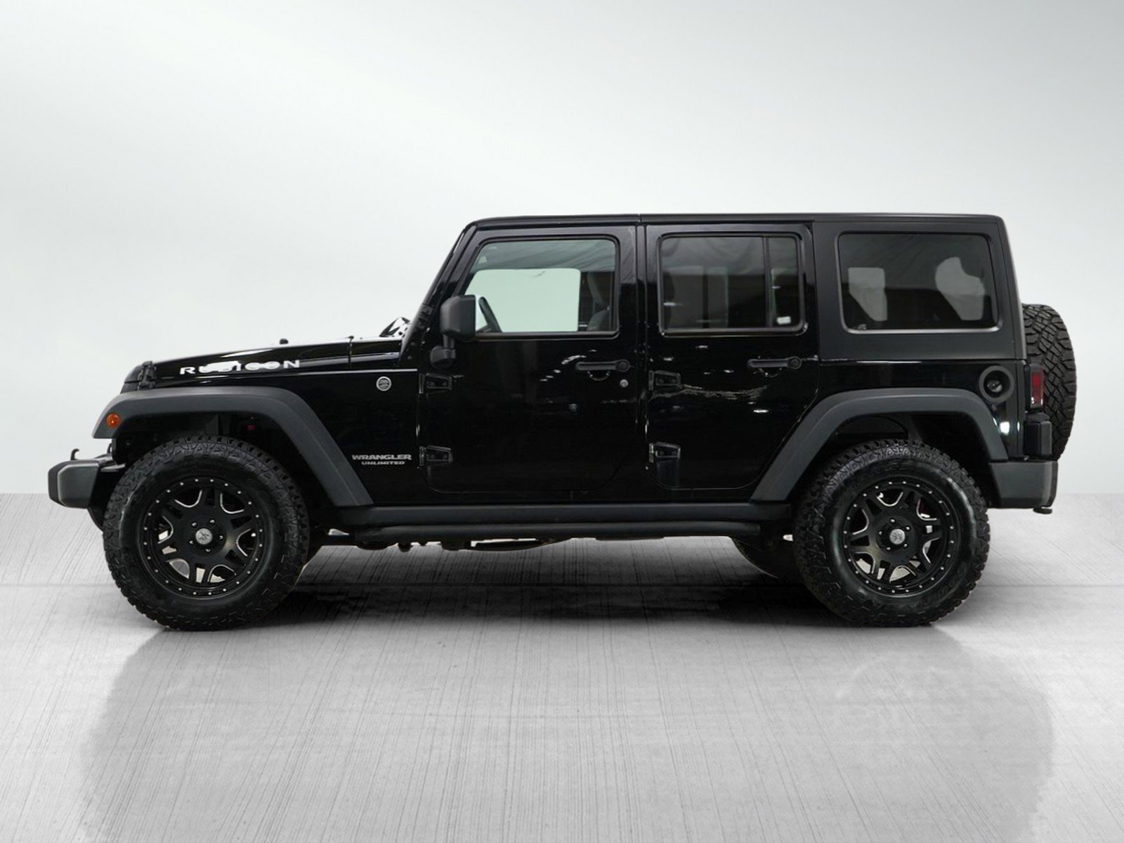 Used 2013 Jeep Wrangler Unlimited Rubicon with VIN 1C4BJWFG7DL694476 for sale in Burnsville, Minnesota