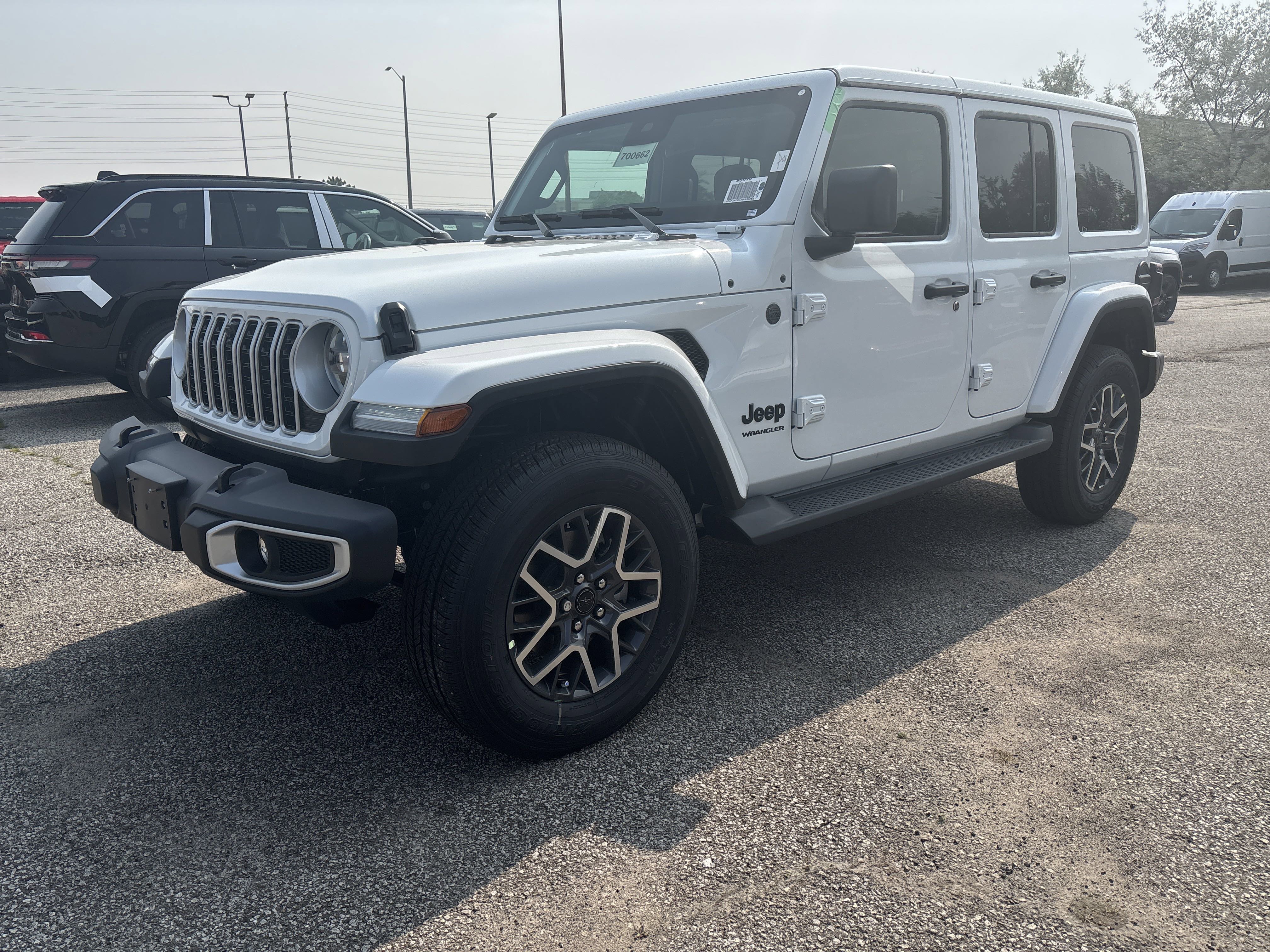 New 2025 Bright White Jeep Sahara image 1