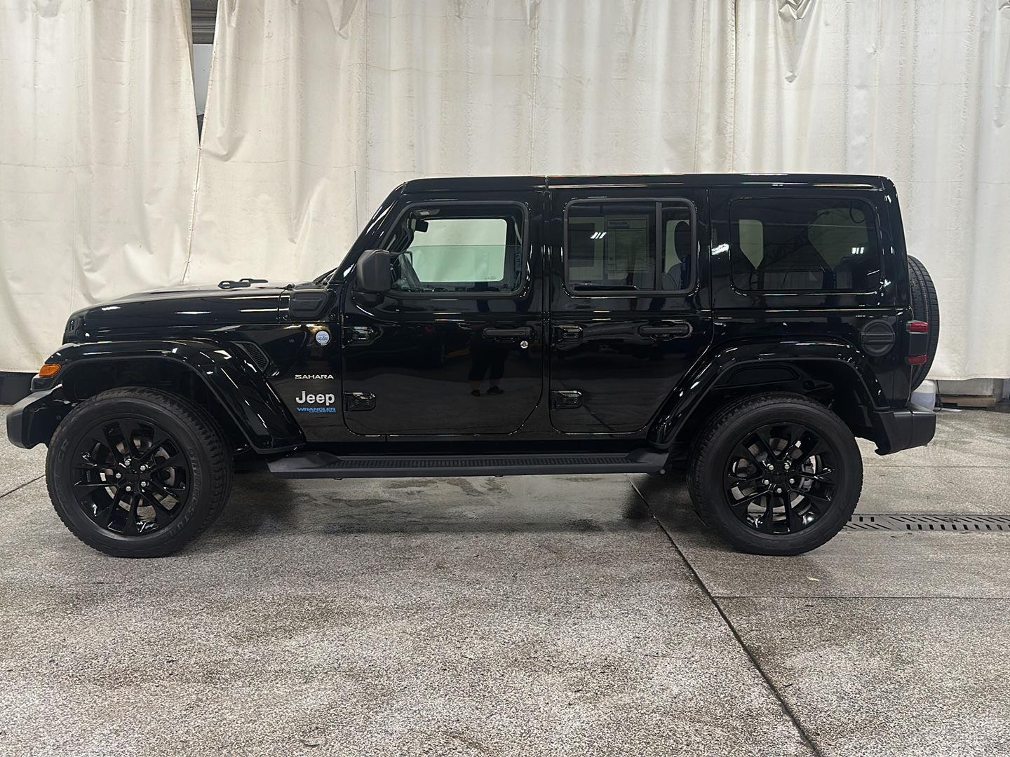 Used 2021 Jeep Wrangler Unlimited Sahara 4XE with VIN 1C4JJXP69MW654504 for sale in Waconia, Minnesota