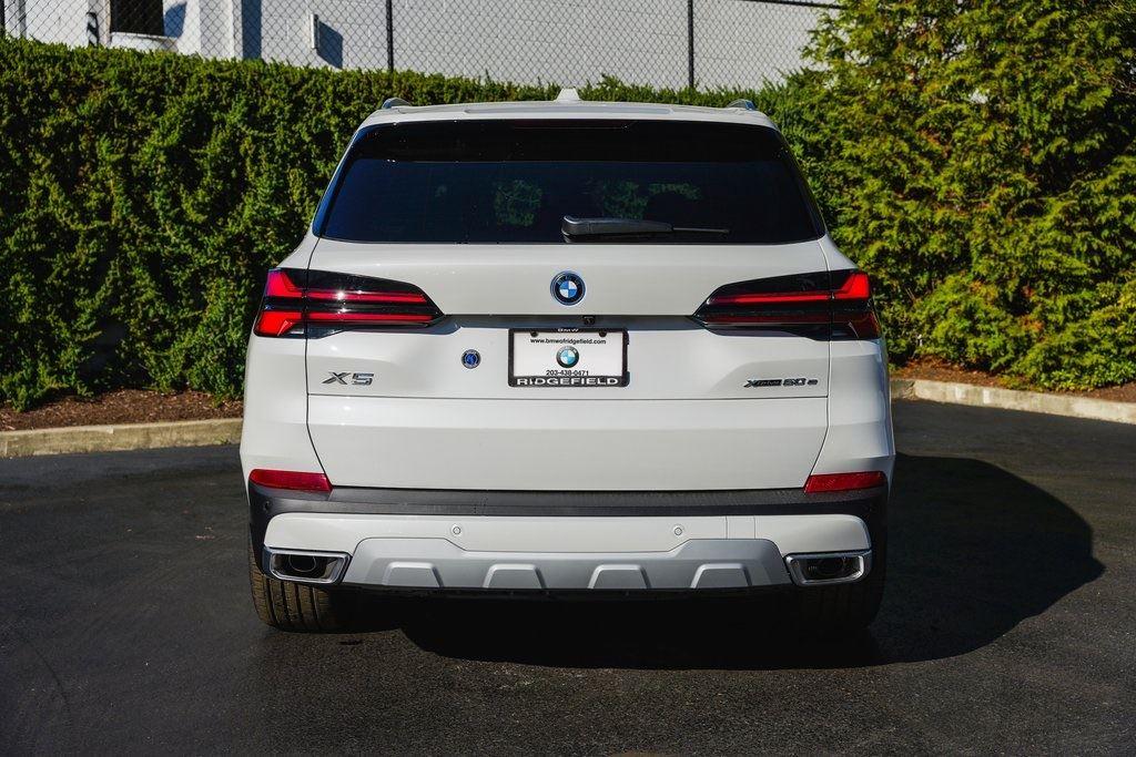 New 2025 Mineral White Metallic BMW xDrive50e image 8