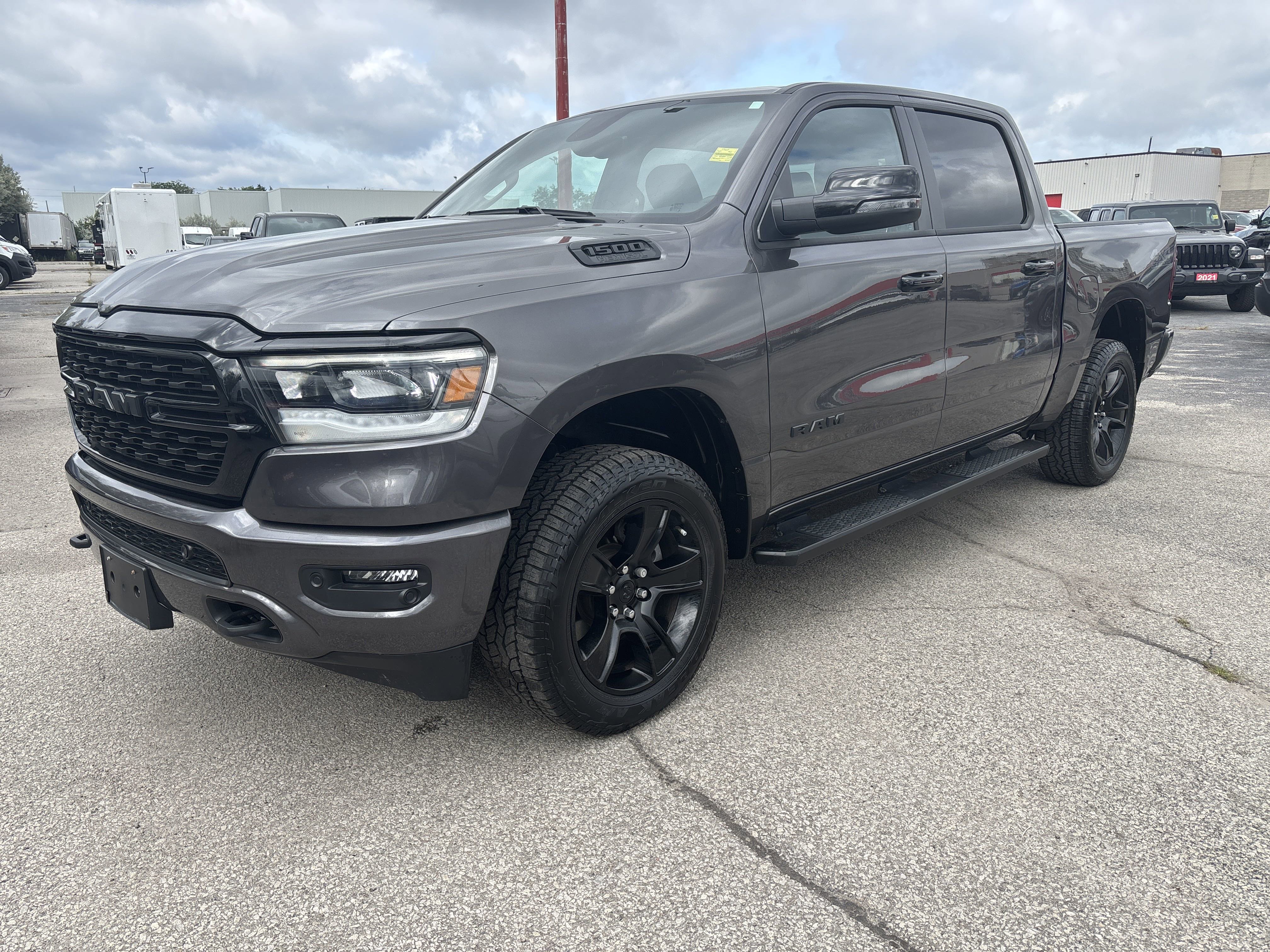 Used 2023 GRANITE CRYSTAL;BLK W/ BLK SEATS Ram Big Horn image 1