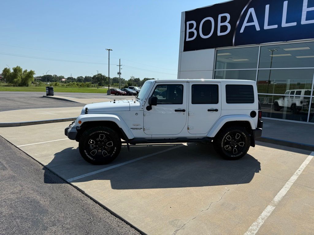 Used 2014 Jeep Wrangler Unlimited Sahara with VIN 1C4BJWEG6EL144284 for sale in Kansas City