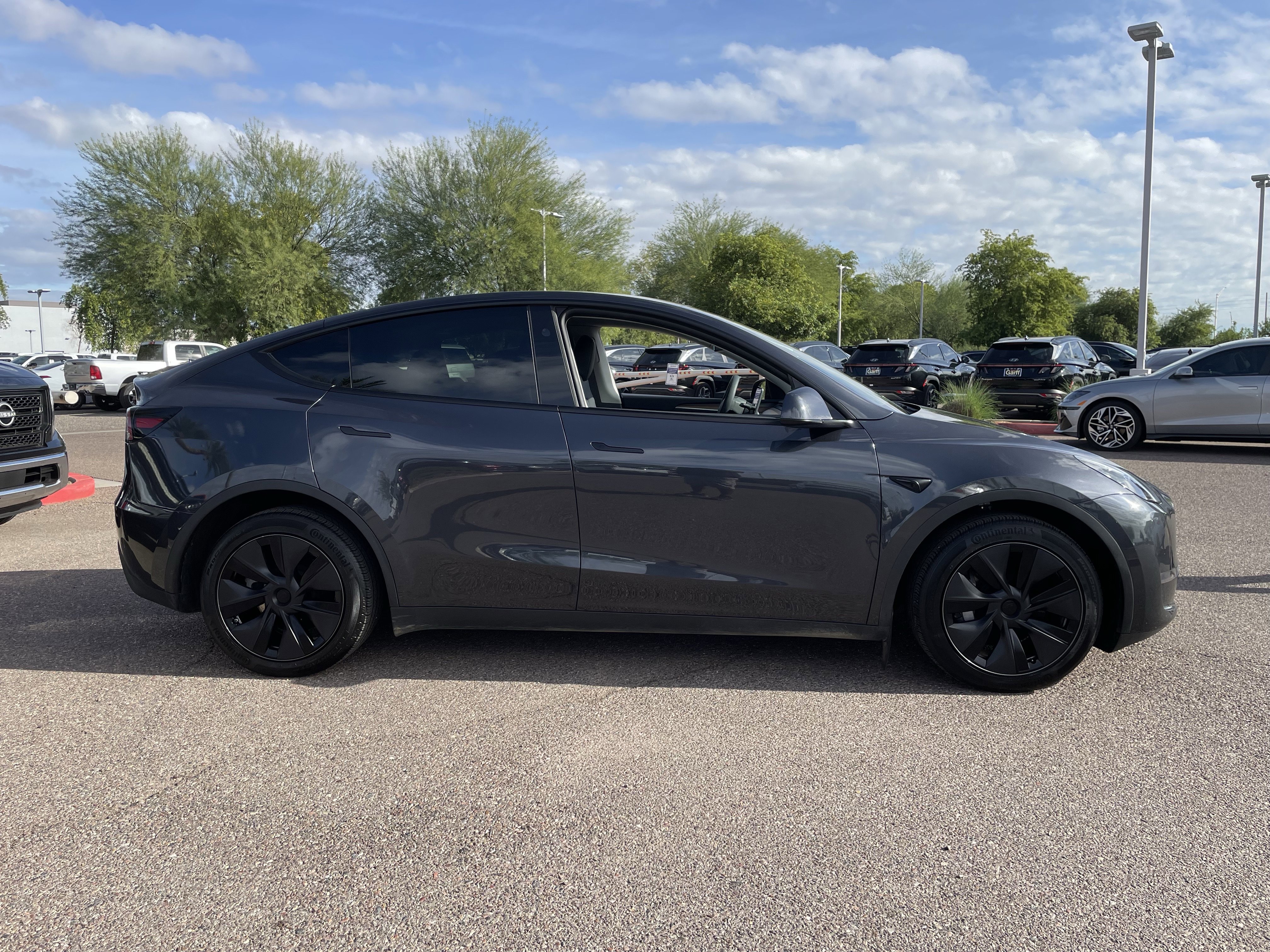 Used 2025 Tesla Model Y Long Range with VIN 7SAYGDEE4SF252383 for sale in Surprise, AZ