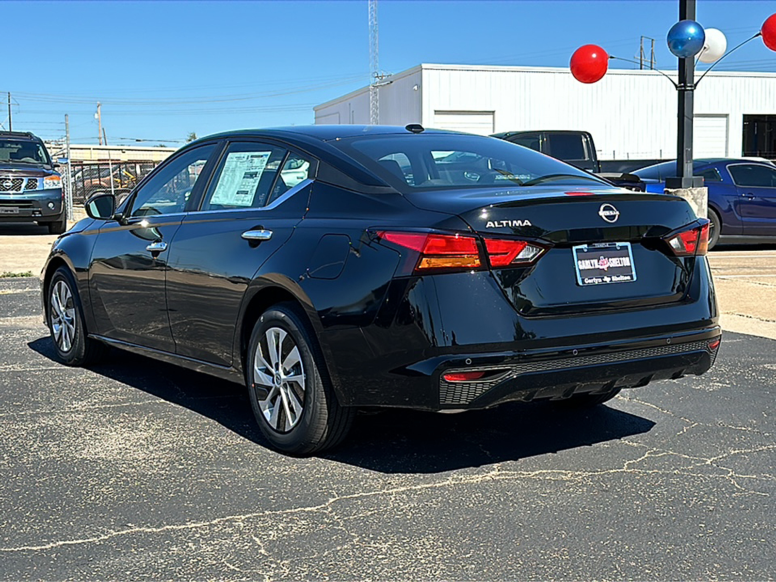 New 2025 Super Black Nissan S FWD image 5