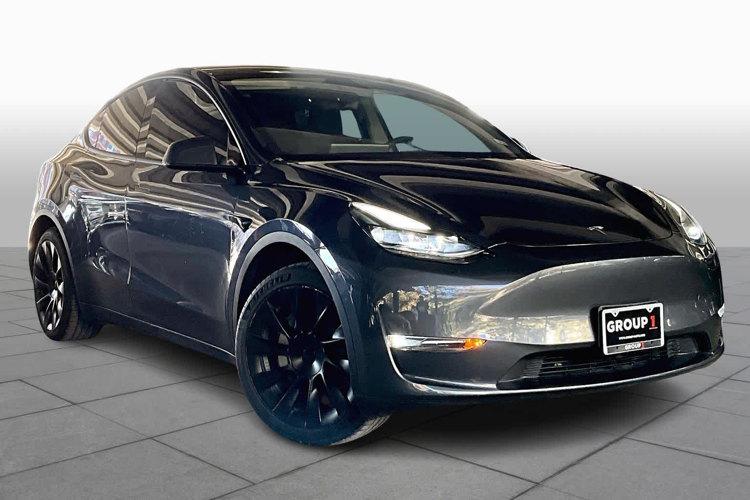 Used 2023 Tesla Model Y Base with VIN 7SAYGDEDXPF945988 for sale in Houston, TX