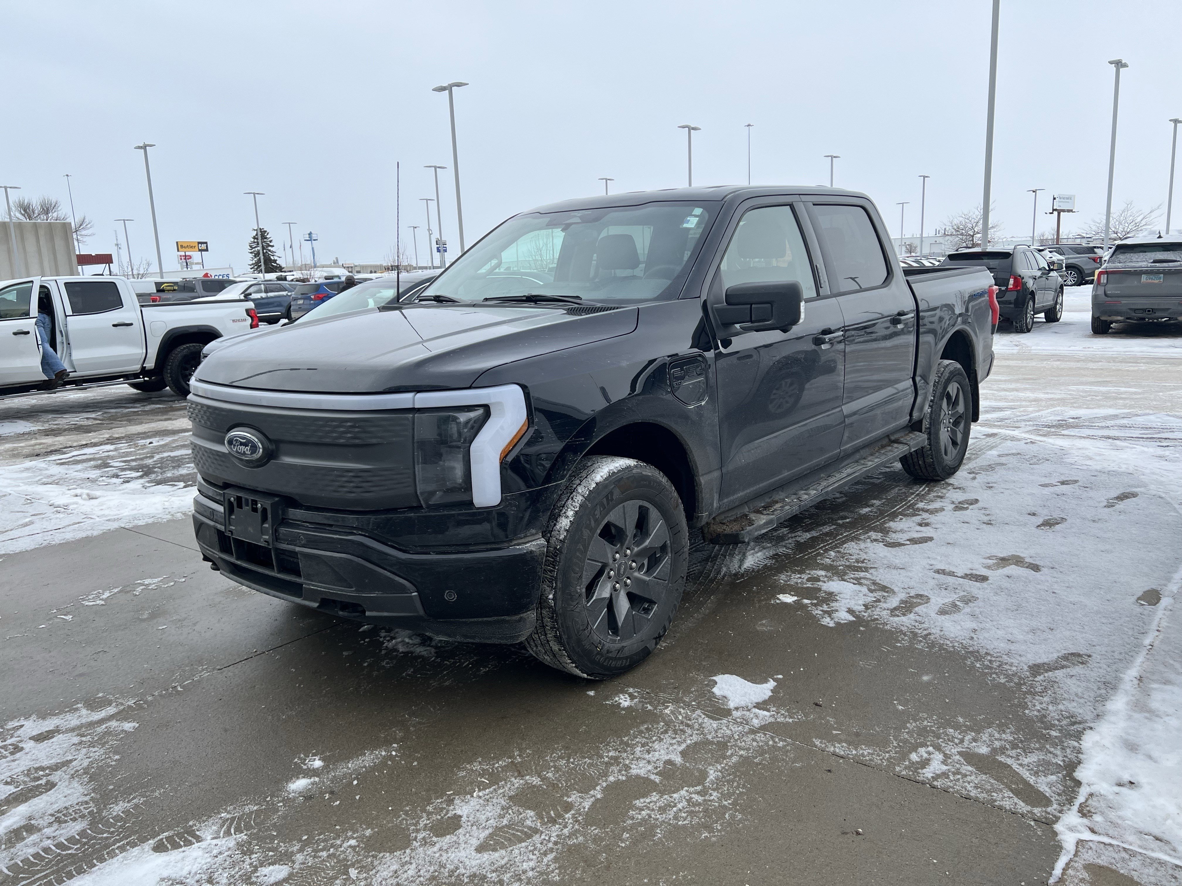 Used 2023 Ford F-150 Lightning XLT with VIN 1FT6W1EV0PWG27761 for sale in Fargo, ND