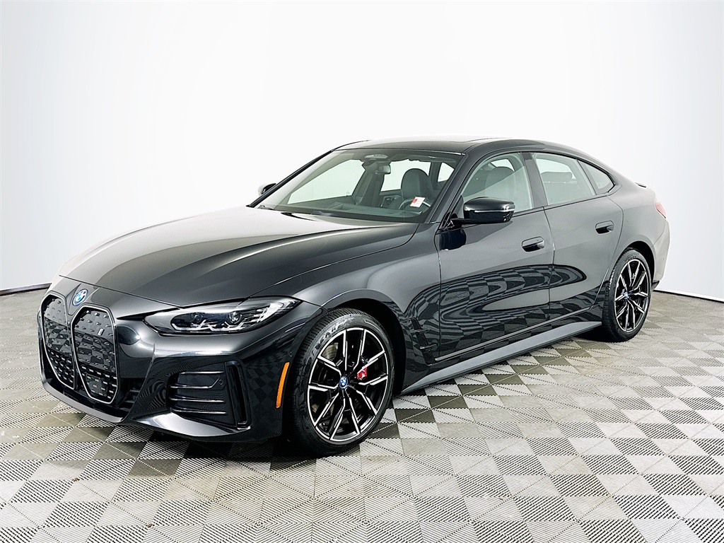 Used 2024 Black Sapphire Metallic BMW xDrive40 image 1