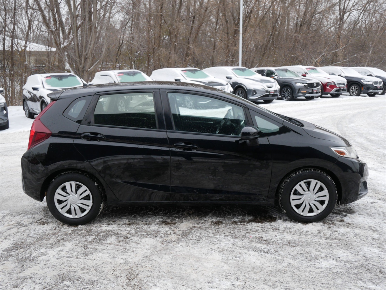 Used 2016 Honda Fit LX with VIN JHMGK5H51GX002751 for sale in Maplewood, Minnesota